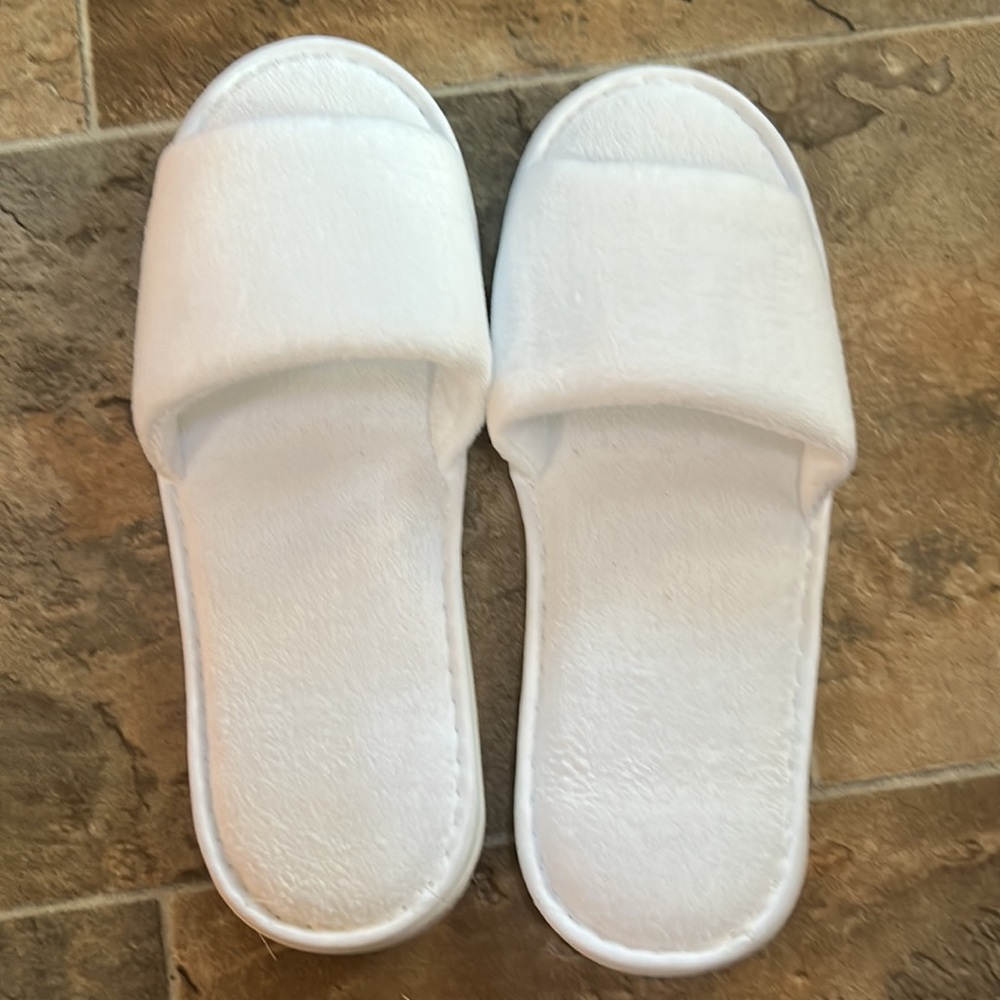 NWOT white slippers.